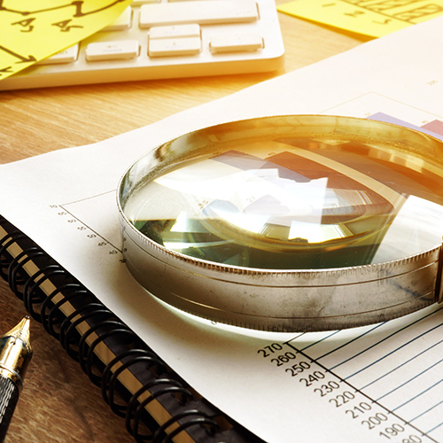 magnifying-glass-and-accounting-paperwork-wallingford-ct
